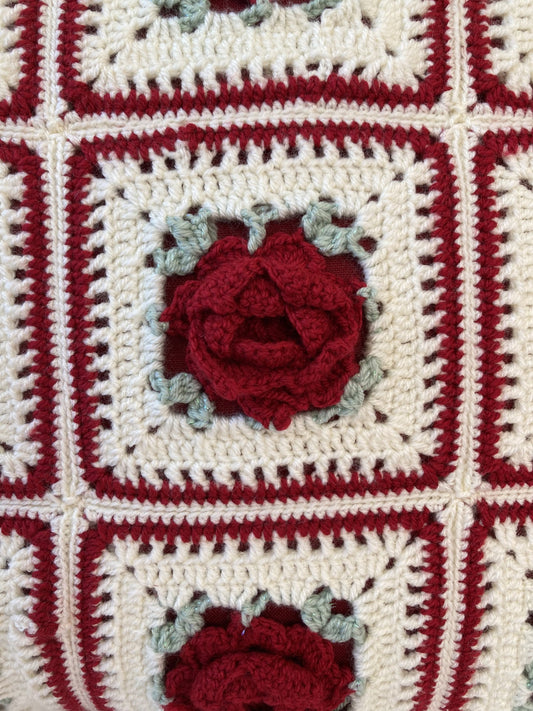 just cushions close up of 3d red roses on a square cushion