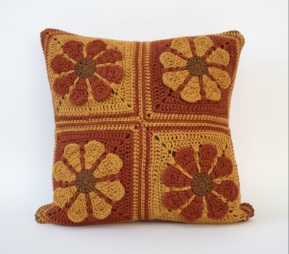 just cushions square crochet cushion with retro daisy pattern in autumn colours 