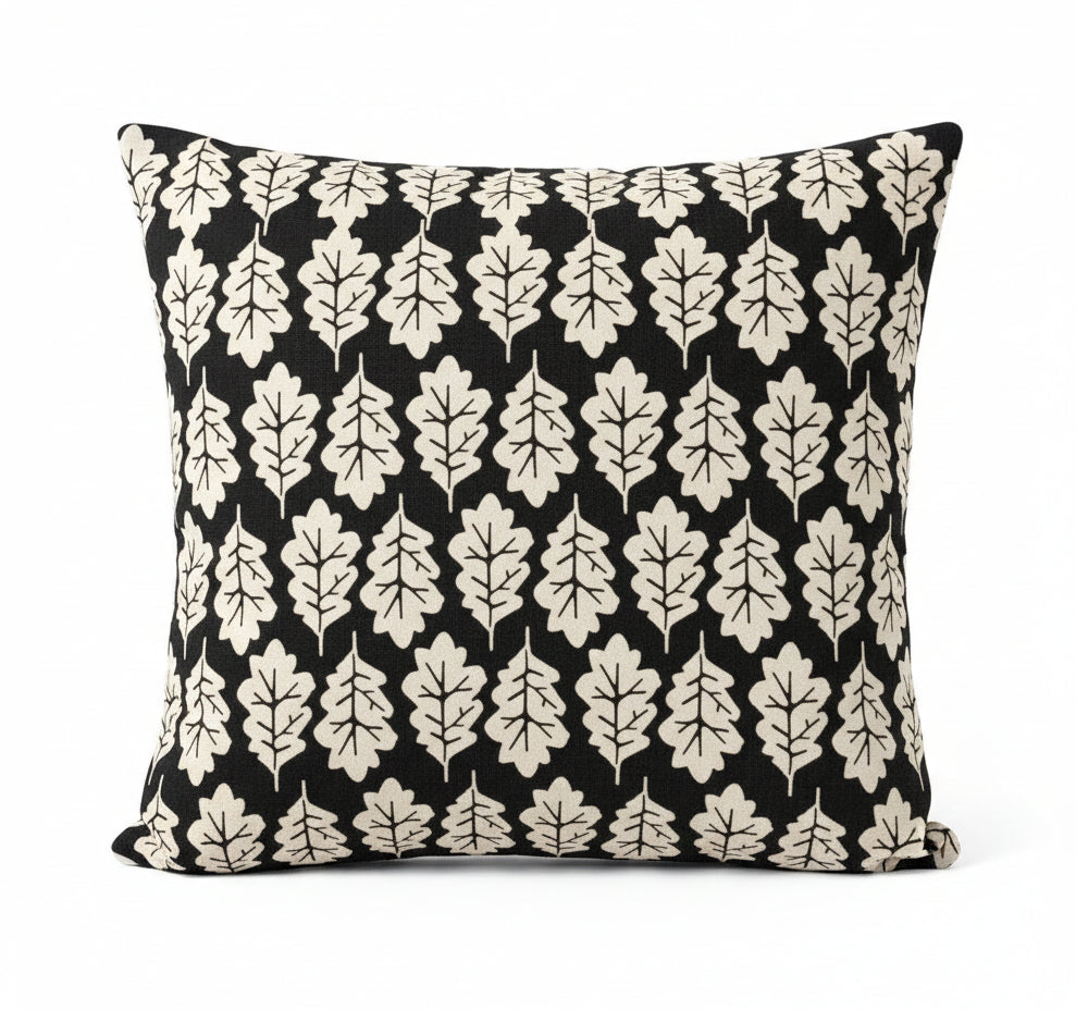just cushions square cushion with a beige oak leaf print on a faded black background 