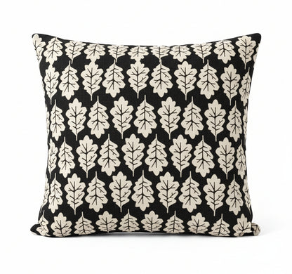 just cushions square cushion with a beige oak leaf print on a faded black background 