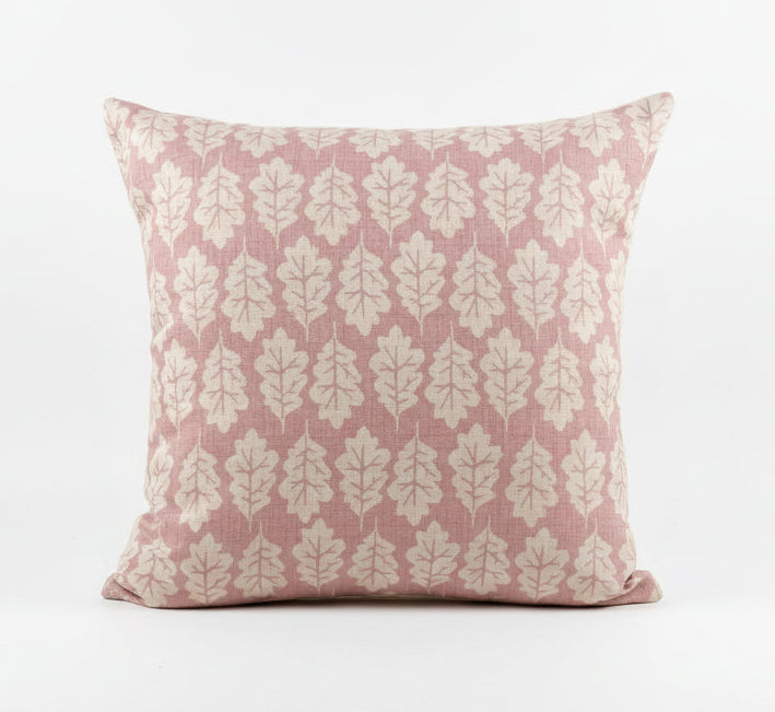 just cushions square cushion with a beige oak leaf print on a dusky pink background 