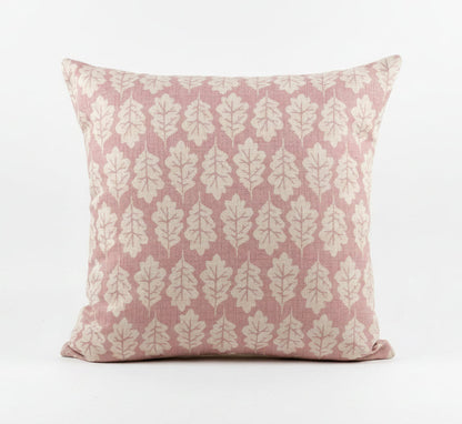 just cushions square cushion with a beige oak leaf print on a dusky pink background 