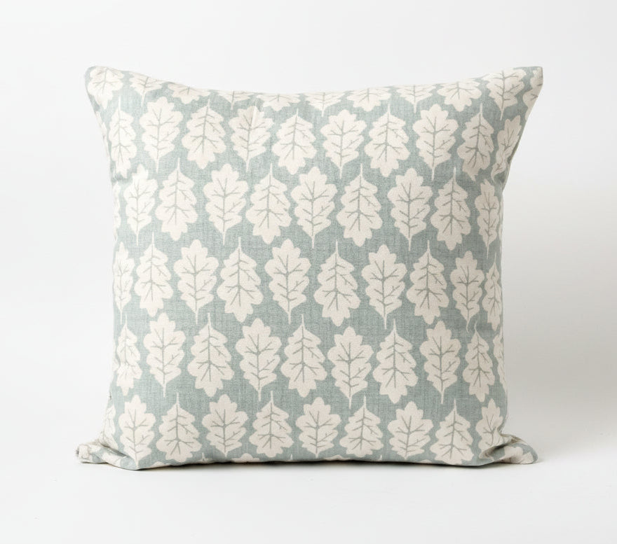 just cushions square cushion with a beige oak leaf print on a duck egg blue background 