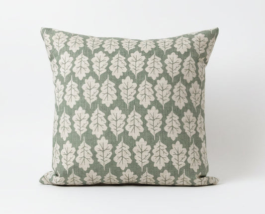 just cushions square oak leaf design cushion beige leaves on a green background 