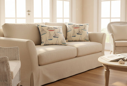 just cushions pair of  yachts cushion with coloured boats on a cream background